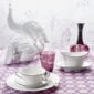 Nymphenburg Adonis Dinnerware with Black Rim on table with purple tablecloth