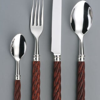 Alain Saint-Joanis Tonga Rosewood Silver Plated Place Setting on grey backdrop
