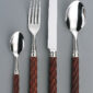 Alain Saint-Joanis Tonga Rosewood Silver Plated Place Setting on grey backdrop