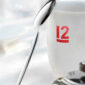Robbe & Berking 12 spoon resting on white mug
