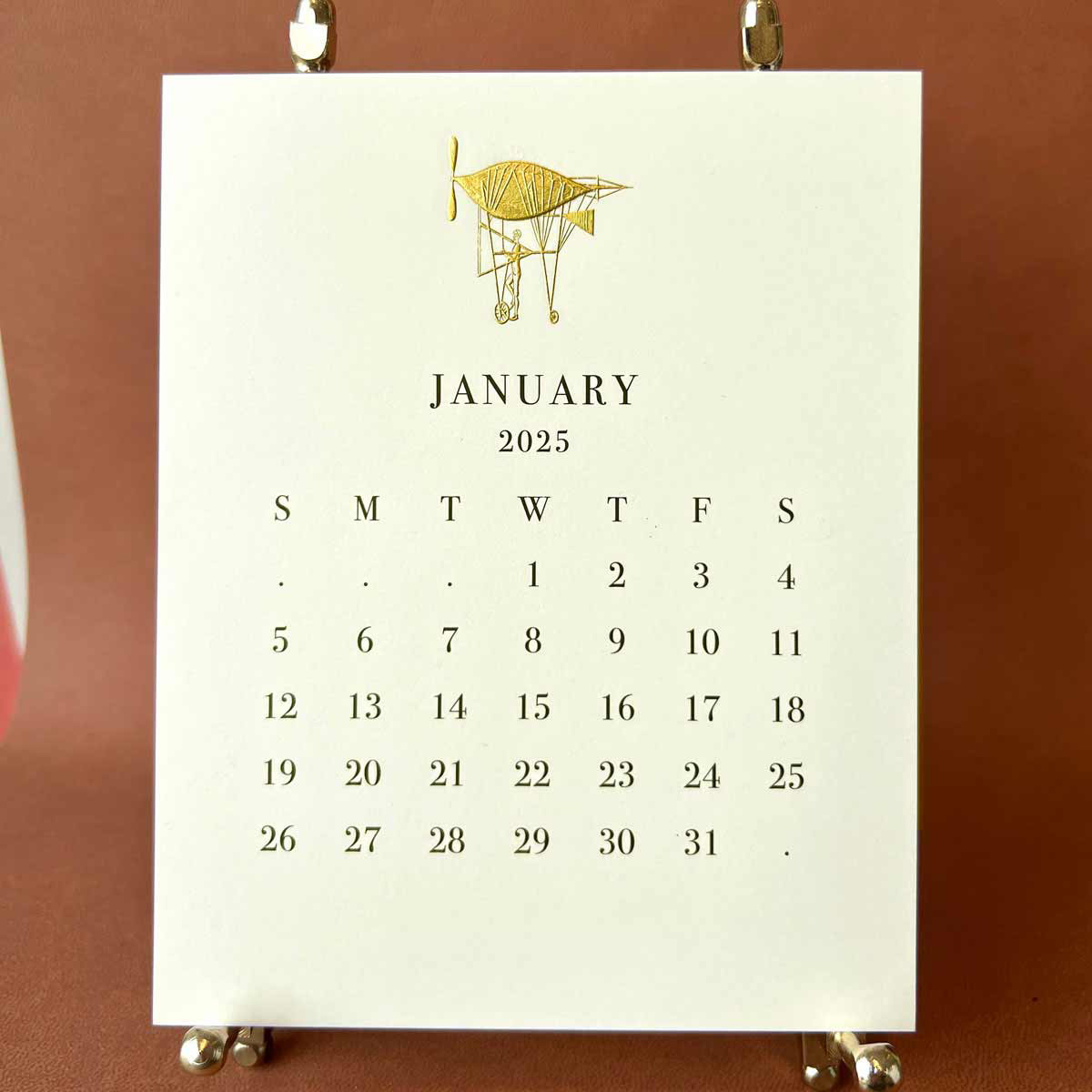 the-printery-2025-ecru-calendar-with-brass-easel-kneen-co