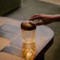 Saint-Louis Folia Mini Portable Light with Cut Crystal Base and aluminum top in copper finish.