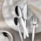 Robbe & Berking Silver Flatware lifestyle photo featuring the "12" pattern on a white Hering Berlin Pulse Plate.