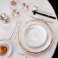 A Table Setting with Puiforcat Cercle d’Orfèvre Porcelain Dinnerware with Cannes Sterling Silver Cutlery