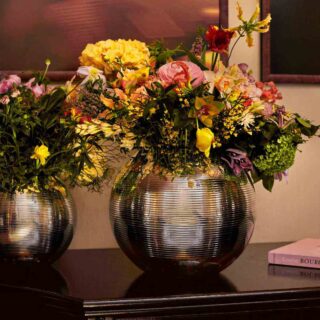 Puiforcat Petanque Vases in Silver Plate Lifestyle photo of 2 vases with flowers | Kneen & Co