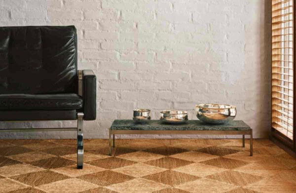 PUIFORCAT-MOOD-Collection-Selene-3-1200w-100KB A lifestyle photo of the Puiforcat Selene Collection featuring the 3 sizes of sterling silver bowls on a coffee table.