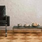 A lifestyle photo of the Puiforcat Selene Collection featuring the 3 sizes of sterling silver bowls on a coffee table.