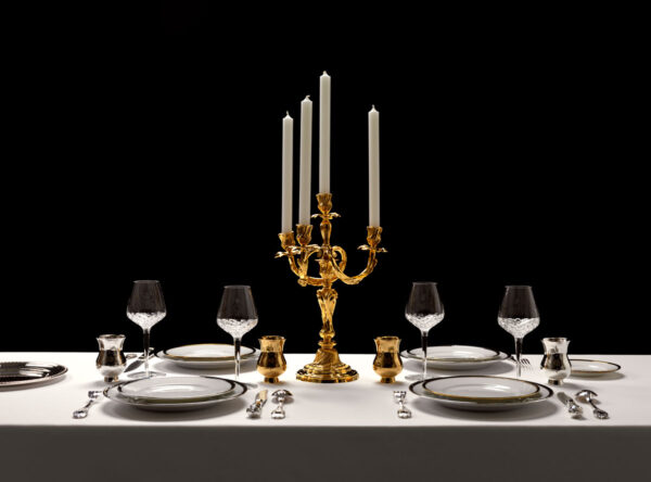 Puiforcat Elysee Flatware in Sterling Silver and Cercle D'Argent Dinnerware; also shown is Saint-Louis Folia Stemware and Puiforcat Champagne Cups in Silver and Gold | Kneen & Co