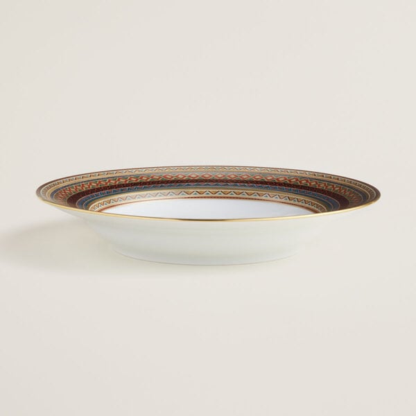HERMES-DNRWR-cheval-dOrient-009813P-worn-3-1200x1200px-100KB Hermes Cheval D'Orient Porcelain Rimmed Soup Plate on table view | Kneen & Co