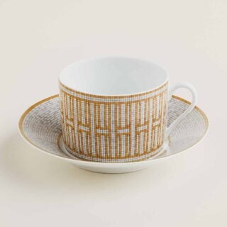 Hermes Mosaique au 24 Gold Breakfast Cup and Saucer shown on table | Kneen & Co