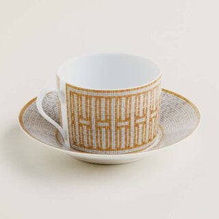 Hermes Mosaique au 24 Gold Breakfast Cup and Saucer shown on table | Kneen & Co