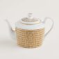 Hermes Mosaique au 24 Gold Teapot shown on table | Kneen & Co