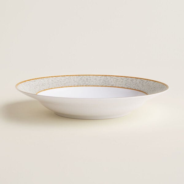 Hermes Mosaique au 24 Gold Round Deep Platter shown on table | Kneen & Co
