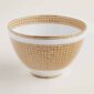 Hermes Mosaique au 24 Gold Punch Bowl shown on table | Kneen & Co