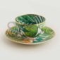 Hermes Passifolia Tea Cup and Saucer shown on table | Kneen & Co