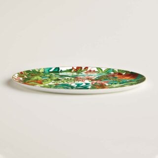Hermes Passifolia Large Round Platter shown on table | Kneen & Co