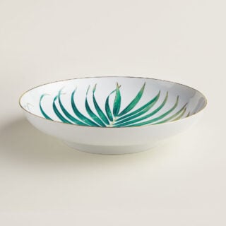 Hermes Passifolia Large Deep Round Platter shown on table | Kneen & Co