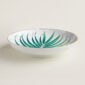 Hermes Passifolia Large Deep Round Platter shown on table | Kneen & Co