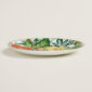 Hermes Passifolia Dessert Plate Passiflora shown on table | Kneen & Co