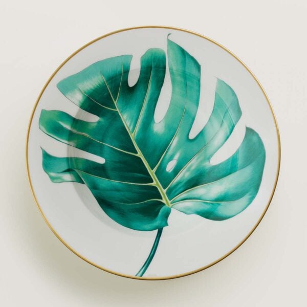 Hermes Passifolia Soup Plate shown on table | Kneen & Co