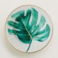 Hermes Passifolia Soup Plate shown on table | Kneen & Co