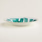 Hermes Passifolia Soup Plate shown on table | Kneen & Co