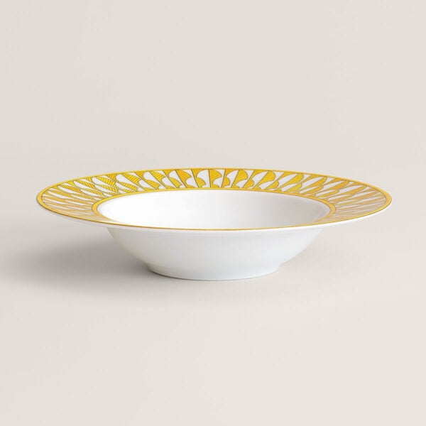 Hermès Soleil d’Hermès Soup Plate shown on table | Kneen & Co