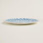 Hermes A Walk in the Garden Blue Dinner Plate shown on table| Kneen & Co