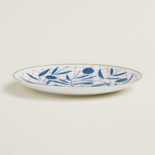Hermes A Walk in the Garden Dessert Plate Blue shown on table| Kneen & Co