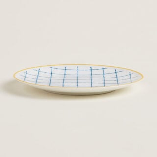 Hermes A Walk in the Garden Bread and Butter Plate Blue shown on table| Kneen & Co