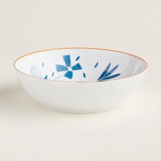 Hermes A Walk in the Garden Cereal Bowl shown on table| Kneen & Co