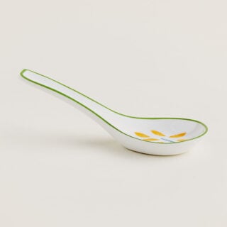 Hermes A Walk in the Garden Soup Spoon shown on table | Kneen & Co