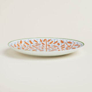 Hermes A Walk in the Garden Dessert Plate Orange Shown on table| Kneen & Co