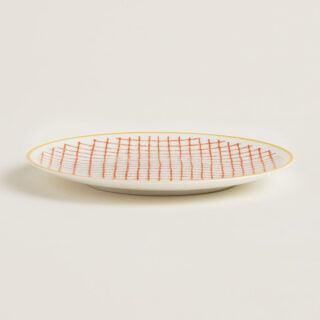 Hermes A Walk in the Garden Bread and Butter Plate Orange shown on table | Kneen & Co