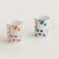 Hermes A Walk in the Garden Set of 2 mugs blue and orange shown on table | Kneen & Co