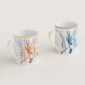 Hermes A Walk in the Garden Set of 2 mugs blue and orange shown on table | Kneen & Co