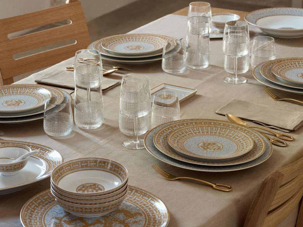 Hermes Mosaique au 24 Gold Dinnerware Table Setting with hermes Intervalle glassware | Kneen & Co
