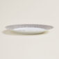 Hermès Mosaique Au 24 Platinum Dinner Plate shown on table | Kneen & Co