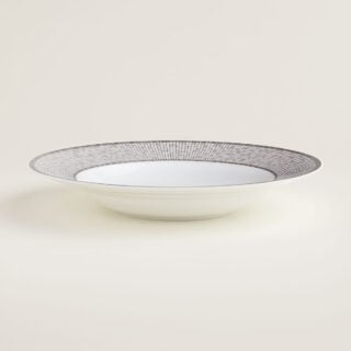 Hermès Mosaique Au 24 Platinum Rim Soup Plate shown on table | Kneen & Co