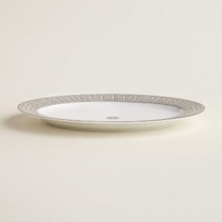 Hermès Mosaique Au 24 Platinum Small Oval Platter shown on table | Kneen & Co