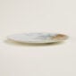 Hermès Carnets d'Equateur Jaguar Dinner Plate shown on table | Kneen & Co