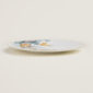 Hermès Carnets d'Equateur Birds Dinner Plate shown on table | Kneen & Co