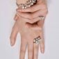 Woman wearing Georg Jensen Moonlight Grapes Bangle in sterling silver | Kneen & Co