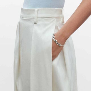 Woman wearing Georg Jensen Moonlight Grapes Bangle in sterling silver | Kneen & Co