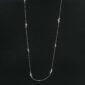 Woman wearing Georg Jensen Moonlight Grapes Sautoir in sterling silver | Kneen & Co