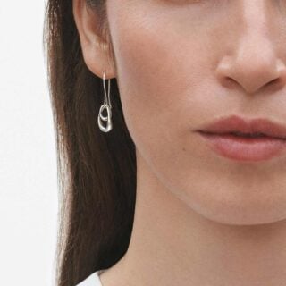 Georg Jensen Offspring Earrings 433A in sterling silver close up on model | Kneen & Co