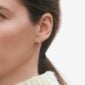 Woman wearing Georg Jensen Signature Diamonds Ear Hoop Gold with Diamonds 0.10 CT | Kneen & Co