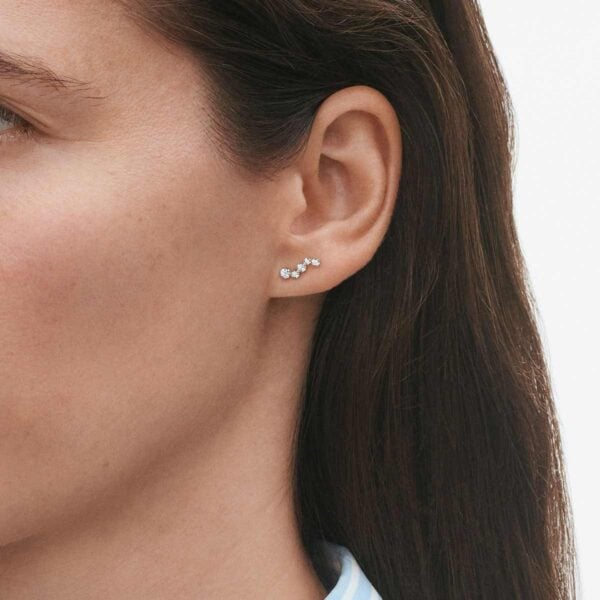 George Jensen Signature Woman wearing Diamonds Ear Stud White Gold With Diamonds 0.18 CT | Kneen & Co