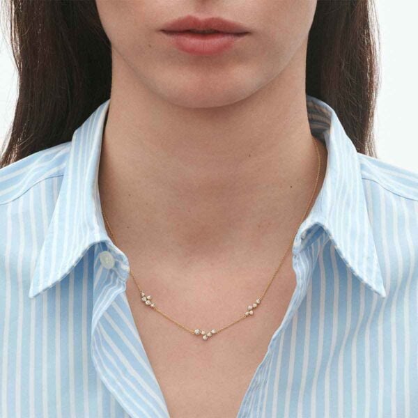 Woman wearing George Jensen Signature Diamonds Necklace 0.47 ct in Yellow Gold | Kneen & Co