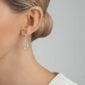 Woman wearing George Jensen Offspring Earrings in sterling silver | Kneen & Co